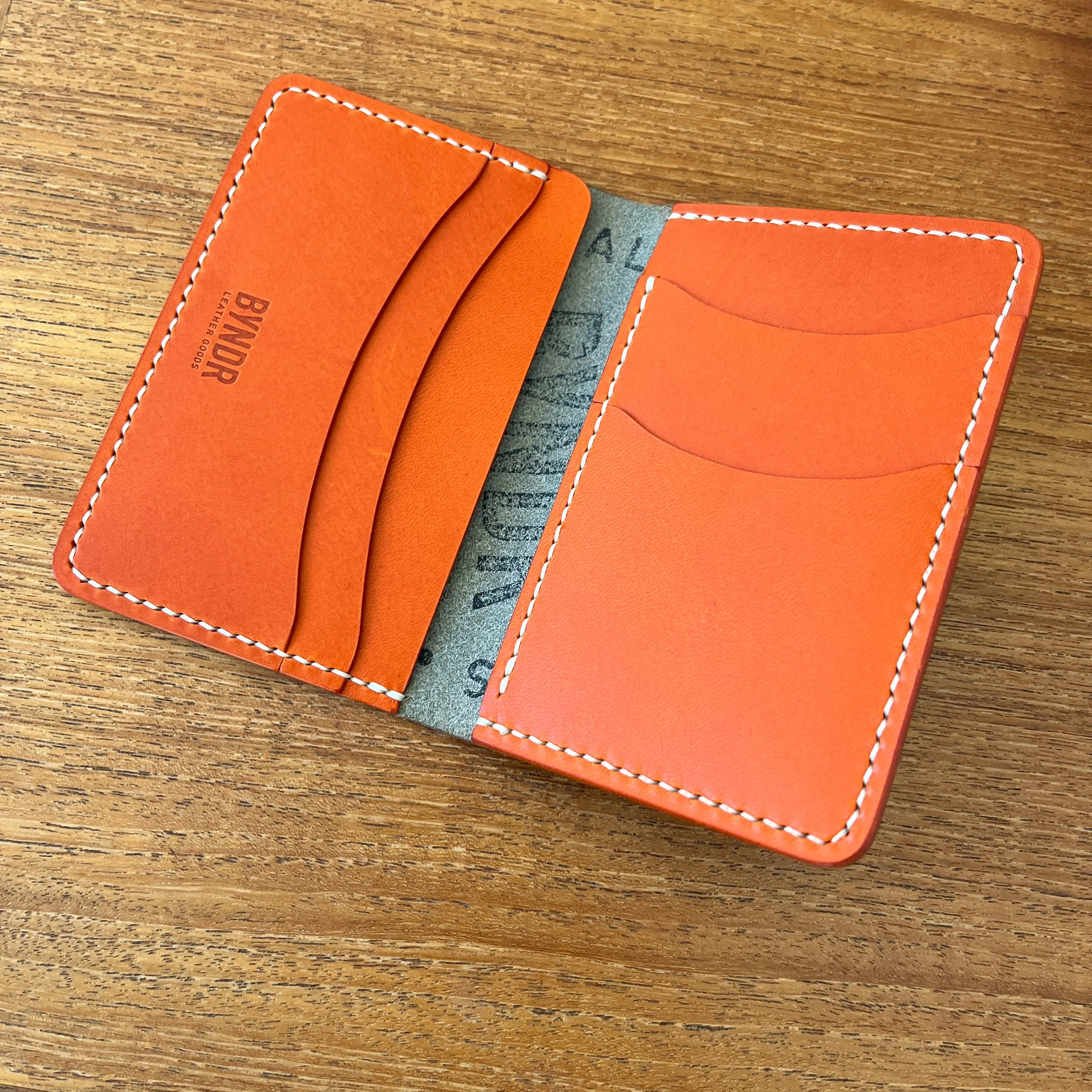 BI-FOLD - GREY PUEBLO   ORANGE